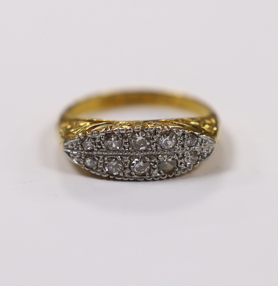 An 18ct, plat. and ten stone diamond set two row ring, size L, gross weight 4.9 grams.